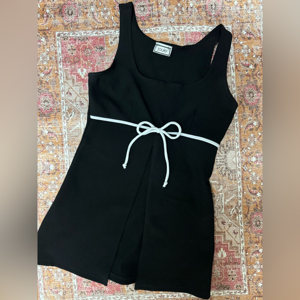 Joule Black Blouse with a white bow and open front.